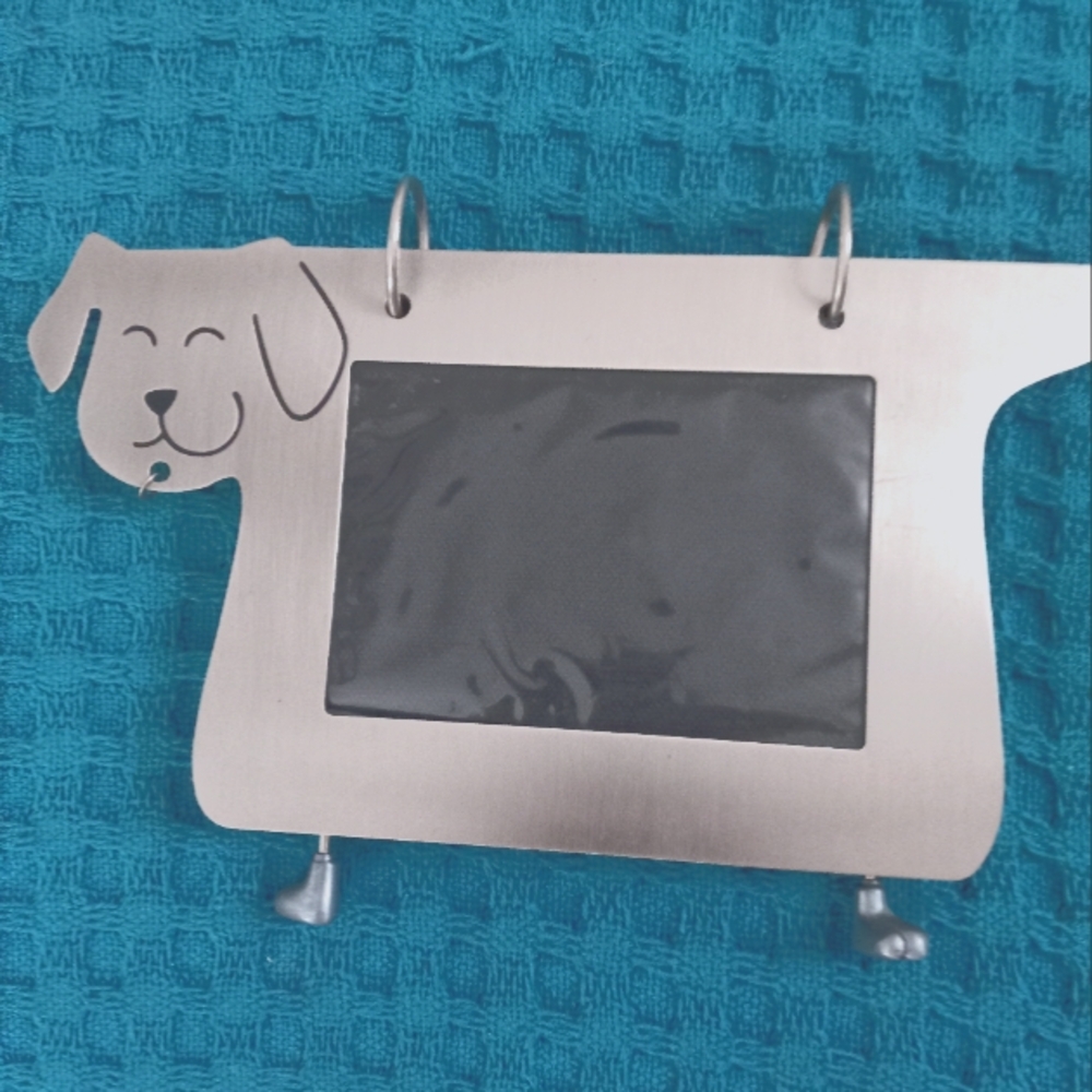 Picture holder, Dog frame. The legs on which it stands are little paws.